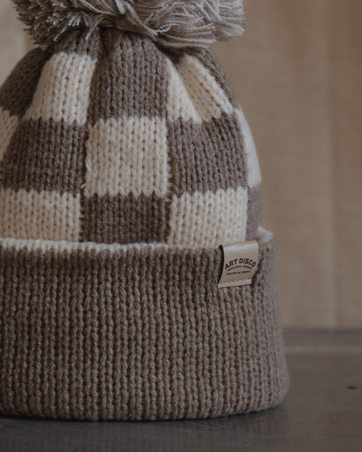 Checkerboard bobble hat beanie by Art Disco in Whitby, North Yorkshire