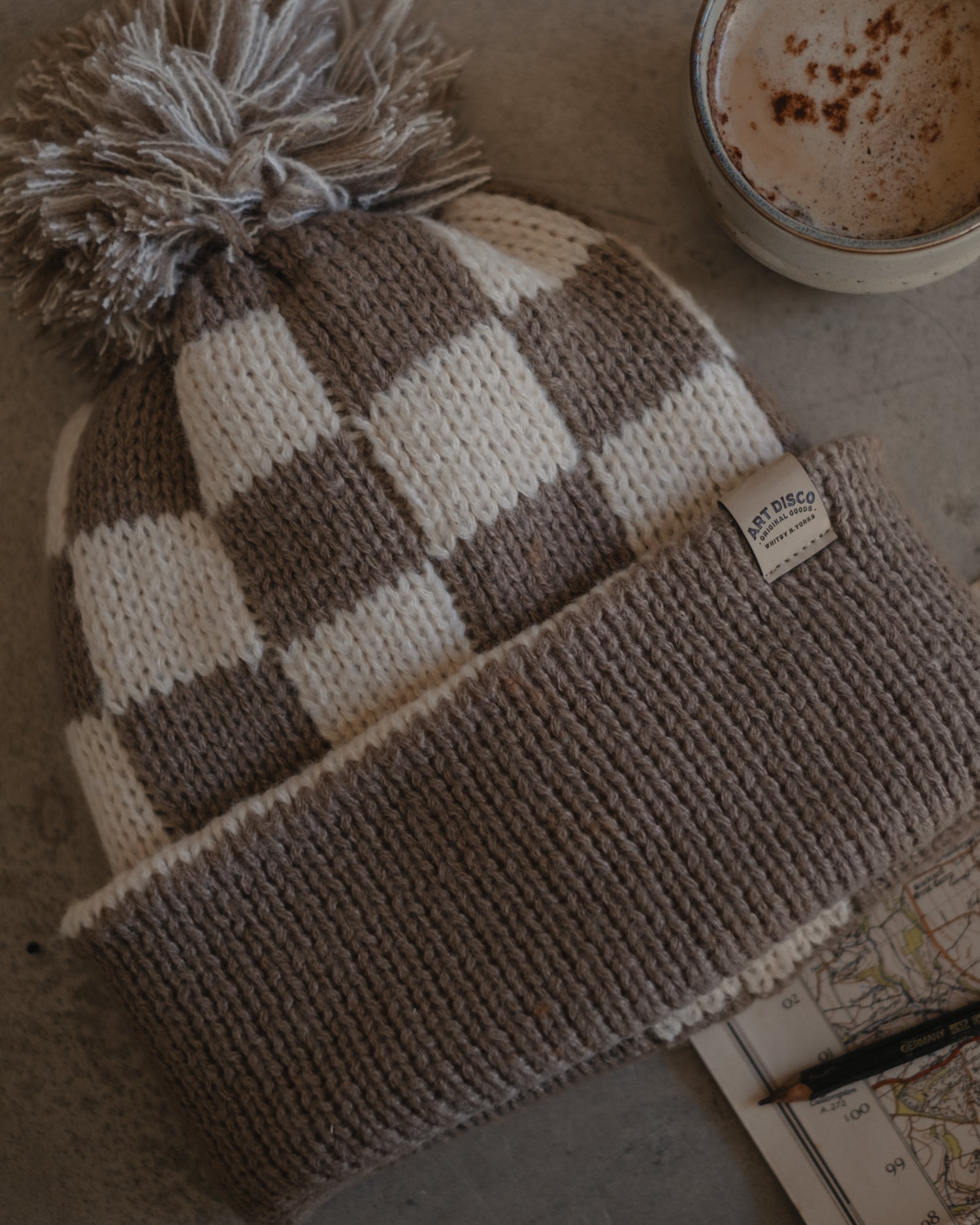 Checkerboard bobble hat beanie by Art Disco in Whitby, North Yorkshire