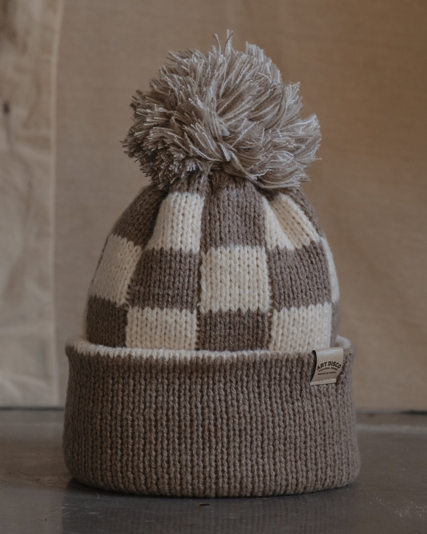 Checkerboard bobble hat beanie by Art Disco in Whitby, North Yorkshire